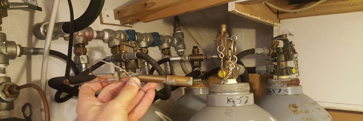 Fixed fire suppression cylinders