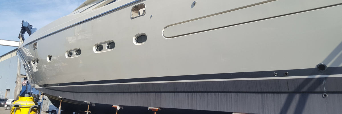 Motor yacht hull on the hard during a refit